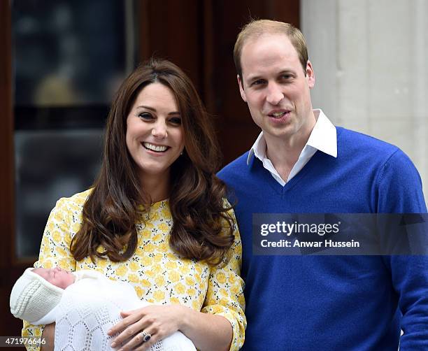 Catherine Duchess of Cambridge, wearing a Jenny Packham dress, and Prince William, Duke of Cambridge leave the Lindo Wing at St. Mary's Hospital with...