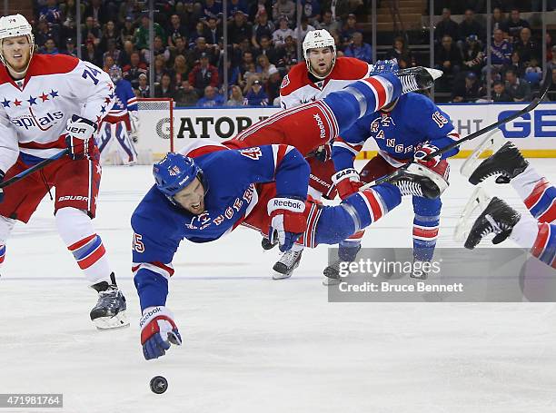 James Sheppard of the New York Rangers is hit by Brooks Orpik of the Washington Capitals during the second period in Game Two of the Eastern...
