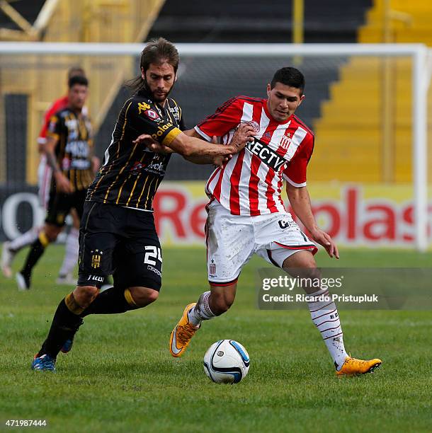 Ezequiel Parnisari of Olimpo fights for the ball with David Barbona of Estudiantes during a match between Olimpo and Estudiantes as part of 11th...