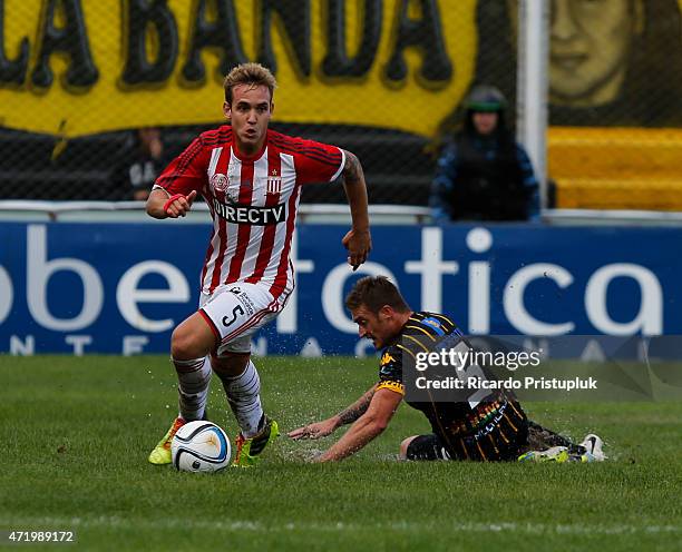 Gaston Gil Romero of Estudiantes leaves Juan Manuel Cobos of Olimpo behind during a match between Olimpo and Estudiantes as part of 11th round of...