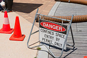 Danger sign warns of confined work space