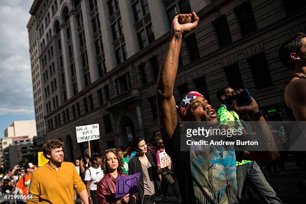 Protesters march from City hall to the Sandtown neighborhood May 2, 2015 in Baltimore, Maryland. Freddie Gray was arrested for possessing a switch...