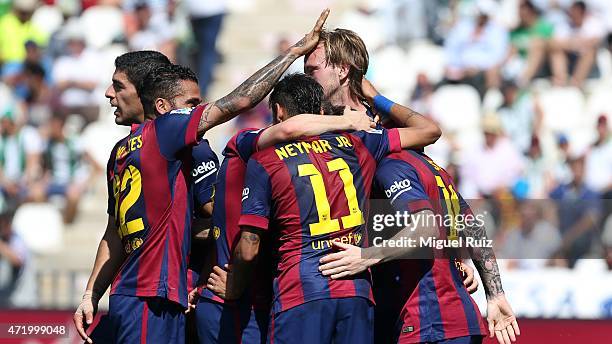 Rakitic of FC Barcelona celebrates with his team-mates as he scored the first goal during the La Liga match between Cordoba CF and FC Barcelona at...