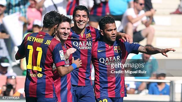 Luis Suarez of FC Barcelona celebrates with his team-mates Neymar, Lionel Messi and Dani Alves as he scored the eighth goal during the La Liga match...