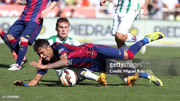 Neymar of FC Barcelona gets injured by Gunino of Cordoba CF during the La Liga match between Cordoba CF and FC Barcelona at Nuevo Arcange on May 2,...