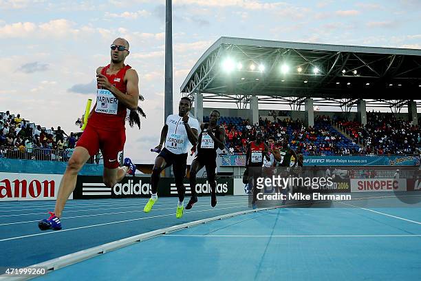 Jeremy Wariner of the United States leads Thomas Jordier of France during round one of the mens 4 x 400 metres relay on day one of the IAAF World...