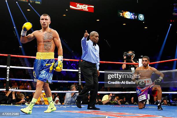 Vasyl Lomachenko celebrates after knocking out Gamalier Rodriguez in the 9th round during their WBO featherweight championship bout on May 2, 2015 at...