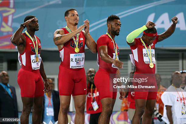 Justin Gatlin, Ryan Bailey, Tyson Gay, and Mike Rodgers of the United States stand on the podium after winning the final of the mens 4 x 100 metres...