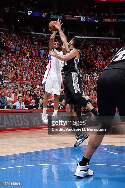 May 2: Chris Paul of the Los Angeles Clippers shoots against Tim Duncan of the San Antonio Spurs in Game Seven of the Western Conference...