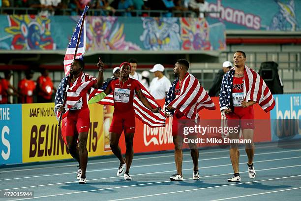 Justin Gatlin, Ryan Bailey, Tyson Gay, and Mike Rodgers of the United States celebrate after winning the final of the mens 4 x 100 metres on day one...