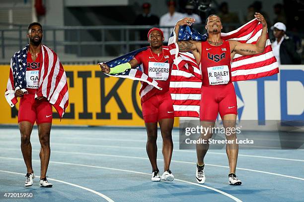 Ryan Bailey, Tyson Gay, and Mike Rodgers of the United States celebrate after winning the final of the mens 4 x 100 metres on day one of the IAAF...