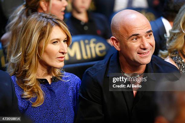 Andre Agassi and wife Steffi Graf watches the Leo Santa Cruz against Jose Cayetano featherweight bout on May 2, 2015 at MGM Grand Garden Arena in Las...