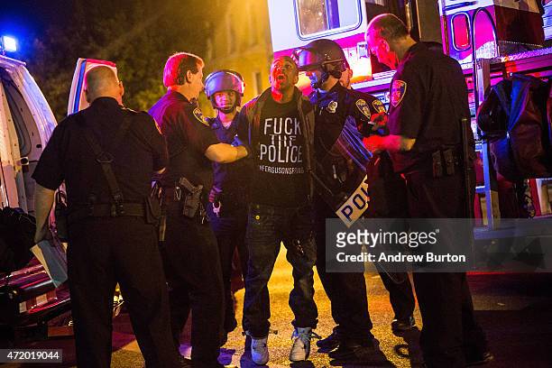 Man is arrested by police at the end of a day of protests in the Sandtown neighborhood where Freddie Gray was arrested on May 2, 2015 in Baltimore,...