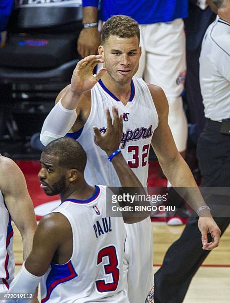 Los Angeles Clippers Chris Paul high fives with his teammate Blake Griffin during their first round NBA playoff game against San Antonio Spurs at...