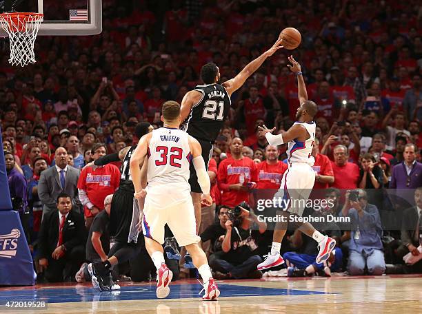 Chris Paul of the Los Angeles Clippers puts up the game winning shot over Tim Duncan of the San Antonio Spurs with one second remaining in Game Seven...