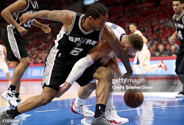 Kawhi Leonard of the San Antonio Spurs and Blake Griffin of the Los Angeles Clippers battle for a loose ball during Game Seven of the Western...