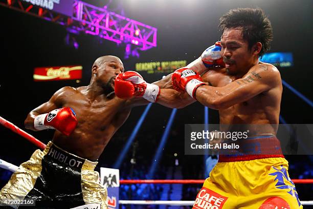 Floyd Mayweather Jr. Exchange punches with Manny Pacquiao during their welterweight unification championship bout on May 2, 2015 at MGM Grand Garden...