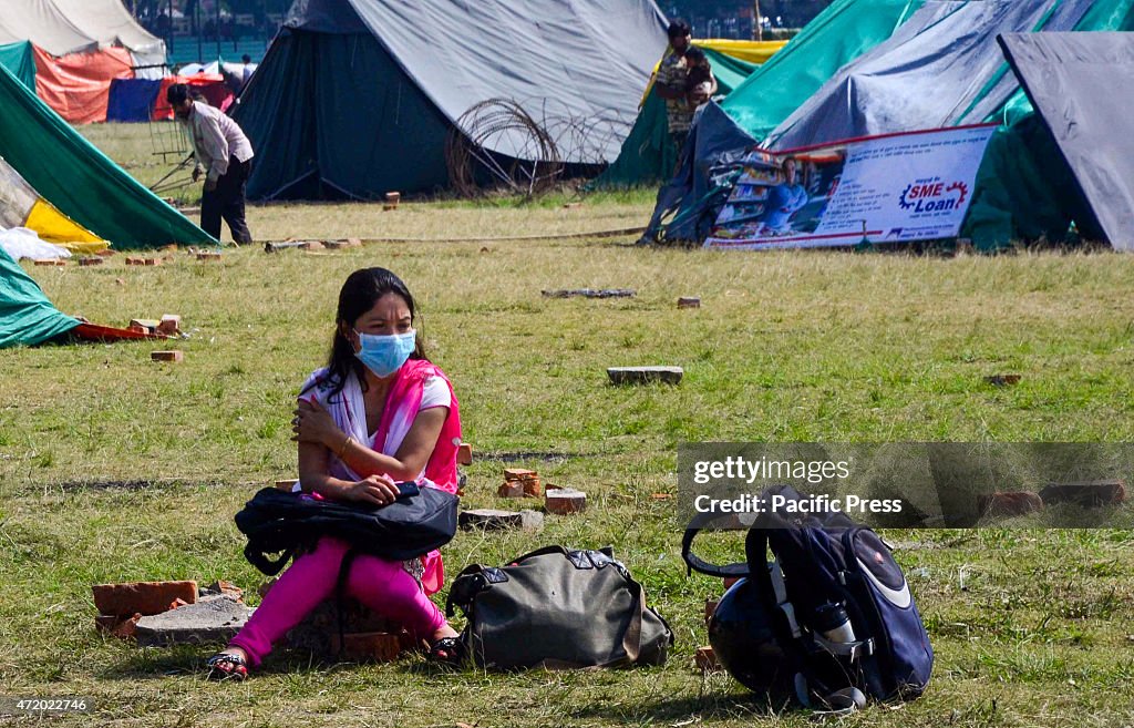 A young girl is waiting her separate shelter to be installed...