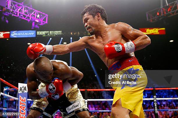 Floyd Mayweather Jr. Ducks as Manny Pacquiao throws a right during their welterweight unification championship bout on May 2, 2015 at MGM Grand...