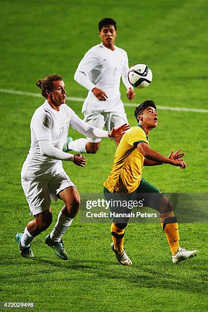 Luka Prelevic of New Zealand defends against Daniel Arzani of Australia during the U20 Five Nations match between New Zealand and Australia at QBE...