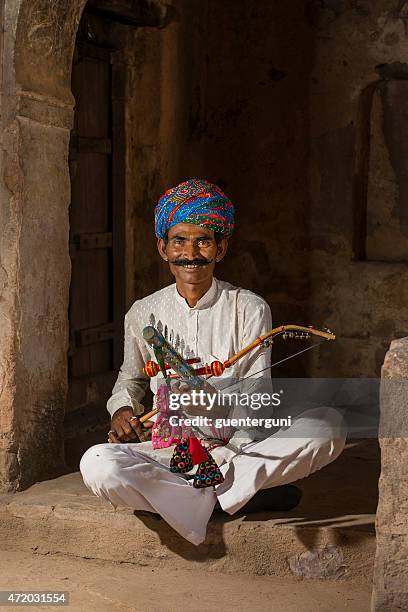 traditional musician from rajasthan, india - indian music band stock pictures, royalty-free photos & images