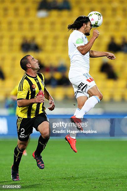 David Williams of Melbourne City heads the ball while Manny Muscat of the Phoenix looks on during the A-League Elimination match between the...