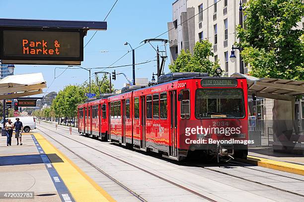san diego’s famous red trolley passing thru downtown - orange county california stockfoto's en -beelden