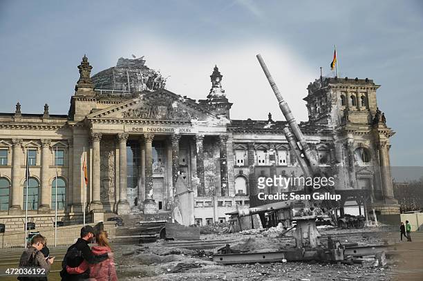 In this digital composite image a comparison has been made showing, a German artillery gun standing in front of the ruins of the Reichstag after...