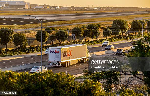 fedex truck on the road, sunset at lax - federal express stock pictures, royalty-free photos & images