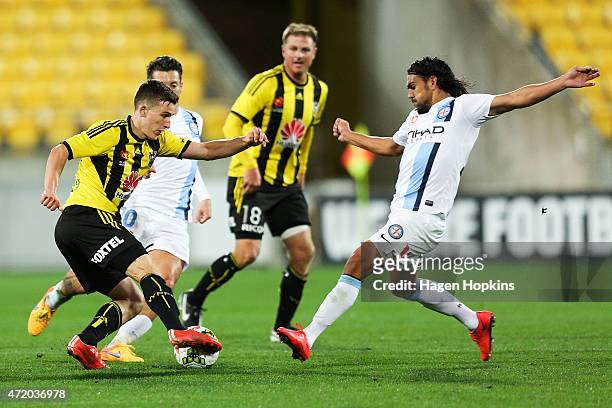 David Williams of Melbourne City challenges Louis Fenton of the Phoenix during the A-League Elimination match between the Wellington Phoenix and...