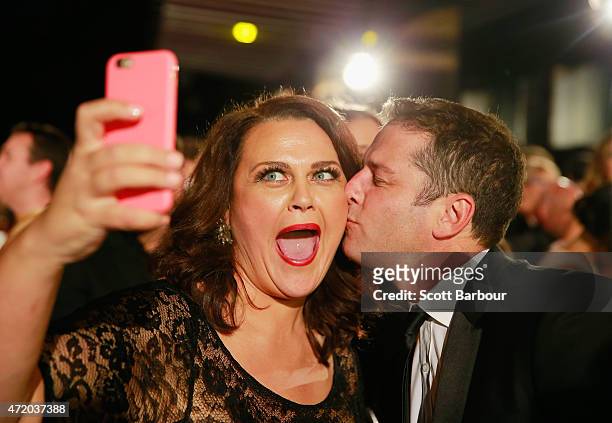 Karl Stefanovic kisses Chrissie Swan as she takes a selfie at the 57th Annual Logie Awards at Crown Palladium on May 3, 2015 in Melbourne, Australia.