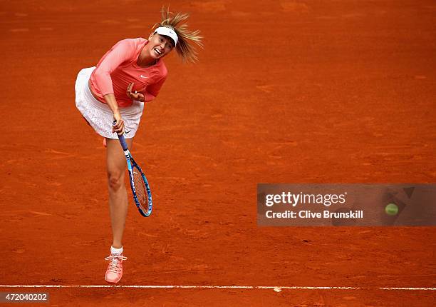 Maria Sharapova of Russia serves against Timea Bacsinszky of Switzerland in their first round match during day two of the Mutua Madrid Open tennis...