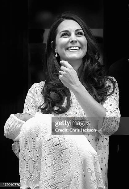 Catherine, Duchess of Cambridge and Prince William, Duke of Cambridge depart the Lindo Wing with their newborn daughter at St Mary's Hospital on May...