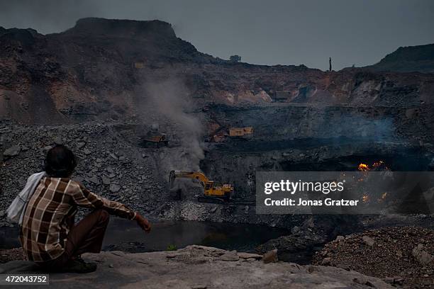 The coal mine in Jharia is oozing fire, methane and other toxic gases spew from the open wounds of the Earth's crust. Jharia has been burning for...