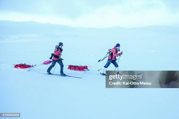 Oyvind Lillehagen and Lars Christian Vold skiing on Hardangervidda, Norway during Expedition Amundsen 2015. The race is knows as "the world's hardest...