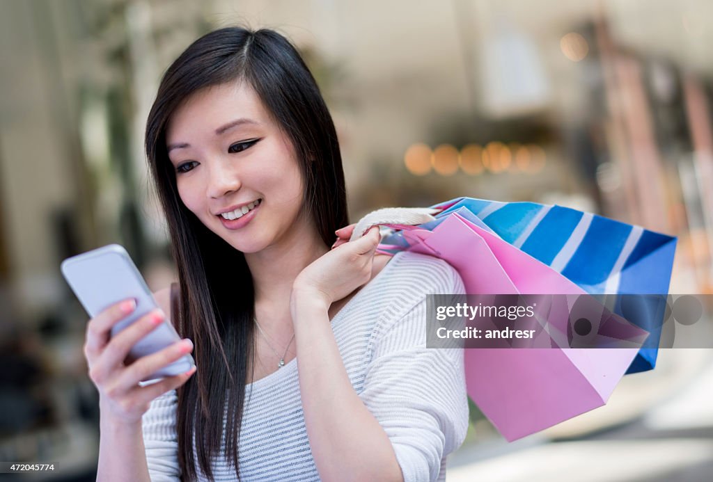 Shopping woman texting