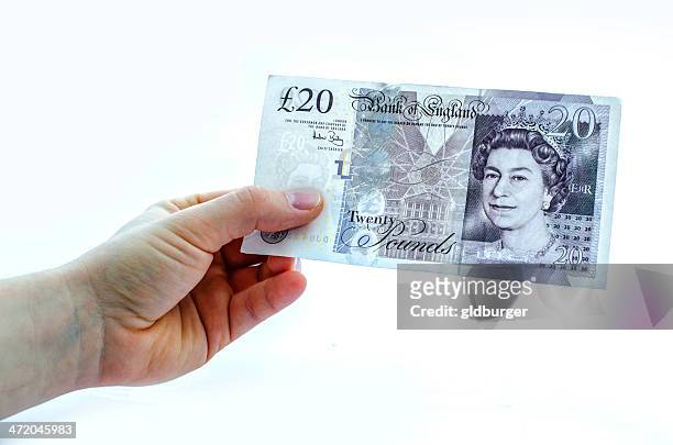 holding a 20 pound note - twenty pound note 個照片及圖片檔
