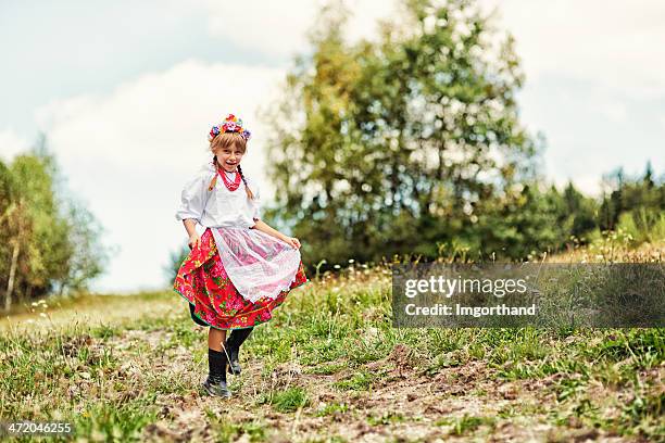 little girl in folk costume (krakowianka) - folk musician stock pictures, royalty-free photos & images