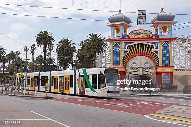 melbourne tram passing luna park - st kilda stock pictures, royalty-free photos & images