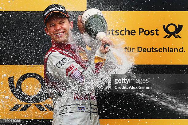 Mattias Ekstroem of Sweden and Audi Sport Team Abt Sportsline celebrates winning during the second race of the DTM 2015 German Touring Car...
