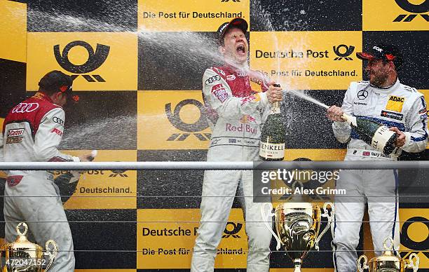 Mattias Ekstroem of Sweden and Audi Sport Team Abt Sportsline celebrates winning the second race of the DTM 2015 German Touring Car Championship with...