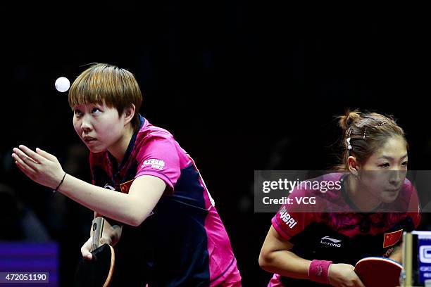 Liu Shiwen and Zhu Yuling of China compete against Ding Ning and Li Xiaoxia of China during women's doubles final match on day eight of the 2015...
