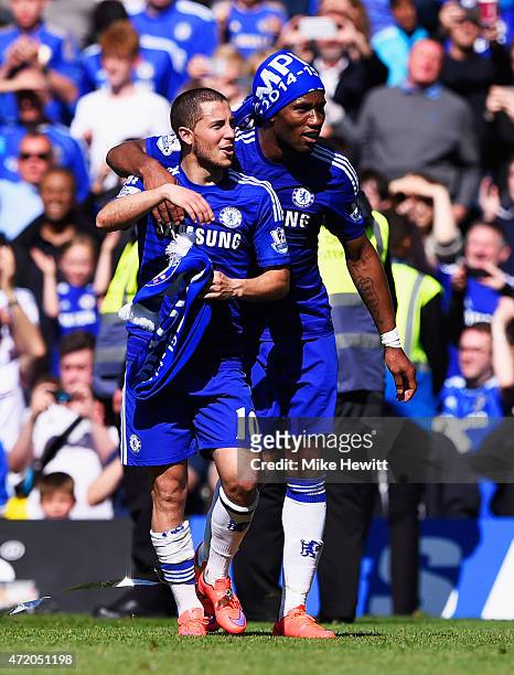 Eden Hazard and Didier Drogba of Chelsea celebrate winning the Premier League title after the Barclays Premier League match between Chelsea and...