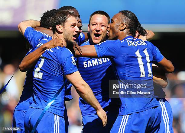 John Terry and Branislav Ivanovic and Didier Drogba of Chelsea celebrate winning the Premier League title after the Barclays Premier League match...