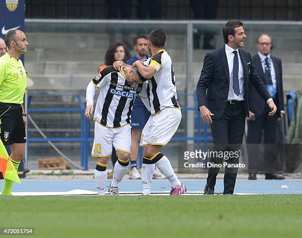 Antonio Di Natale of Udinese Calcio celebrate with is team's mate Giampiero Pinzi after scoring his opening goal during the Serie A match between...