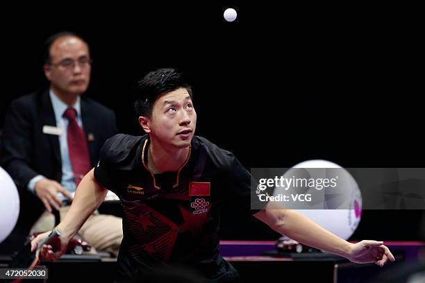 Ma Long of China competes against Fang Bo of China during men's singles final match on day eight of the 2015 World Table Tennis Championships at the...