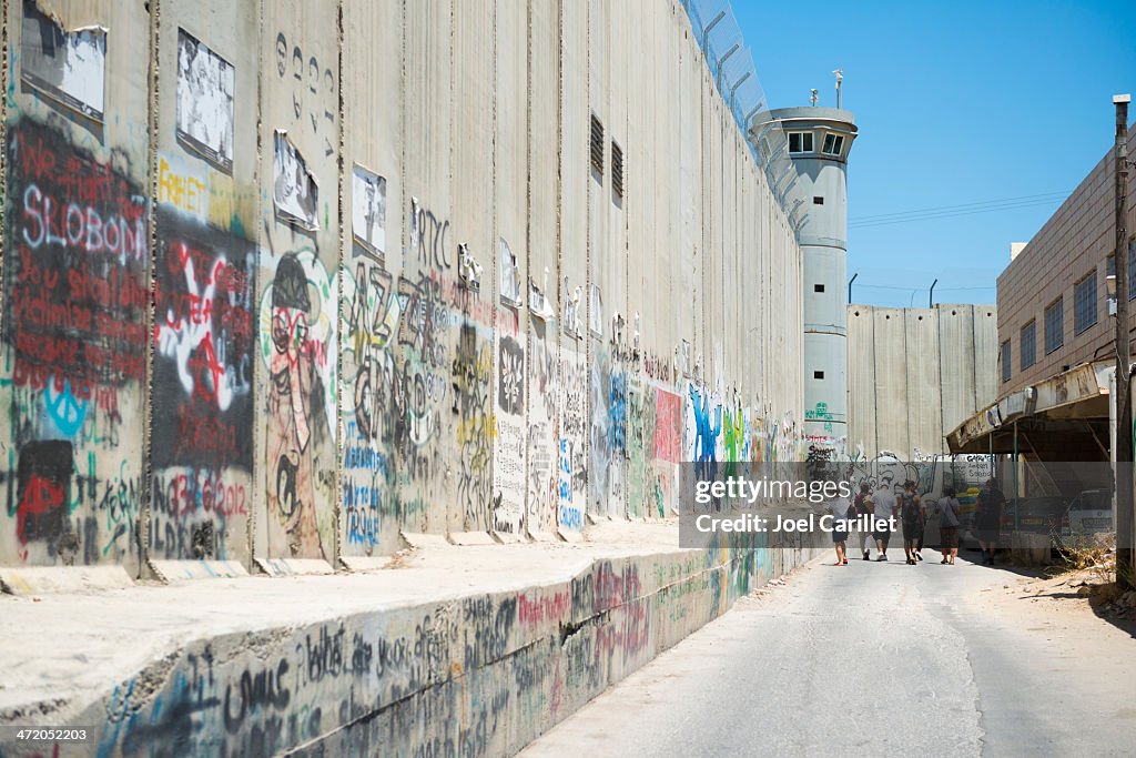 Foreign visitors touring Separation Wall in Bethlehem
