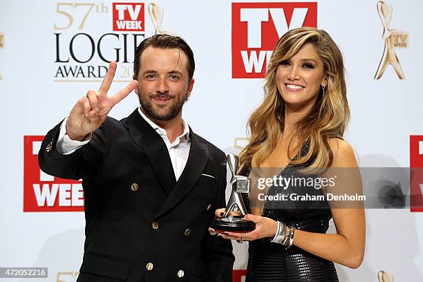 Darren McMullen and Delta Goodrem pose in the awards room after winning a Logie for Most Outstanding Light Entertainment Program at the 57th Annual...