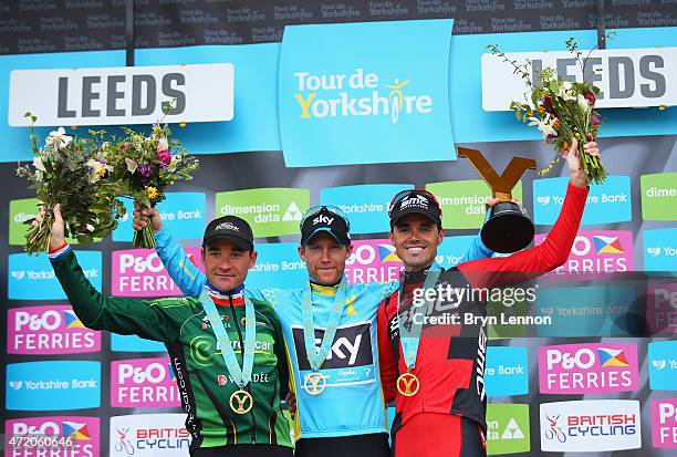 Lars-Petter Nordhaug of Norway and Team Sky celebrates on the podium after his overall victory with second place Samuel Sanchez of Spain and BMC...