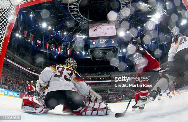 Sidney Crosby of Canada tries to score over Danny aus den Birken , goaltender of Germany during the IIHF World Championship group A match between...
